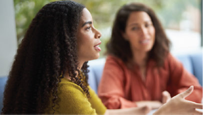 Two colleagues in a meeting.